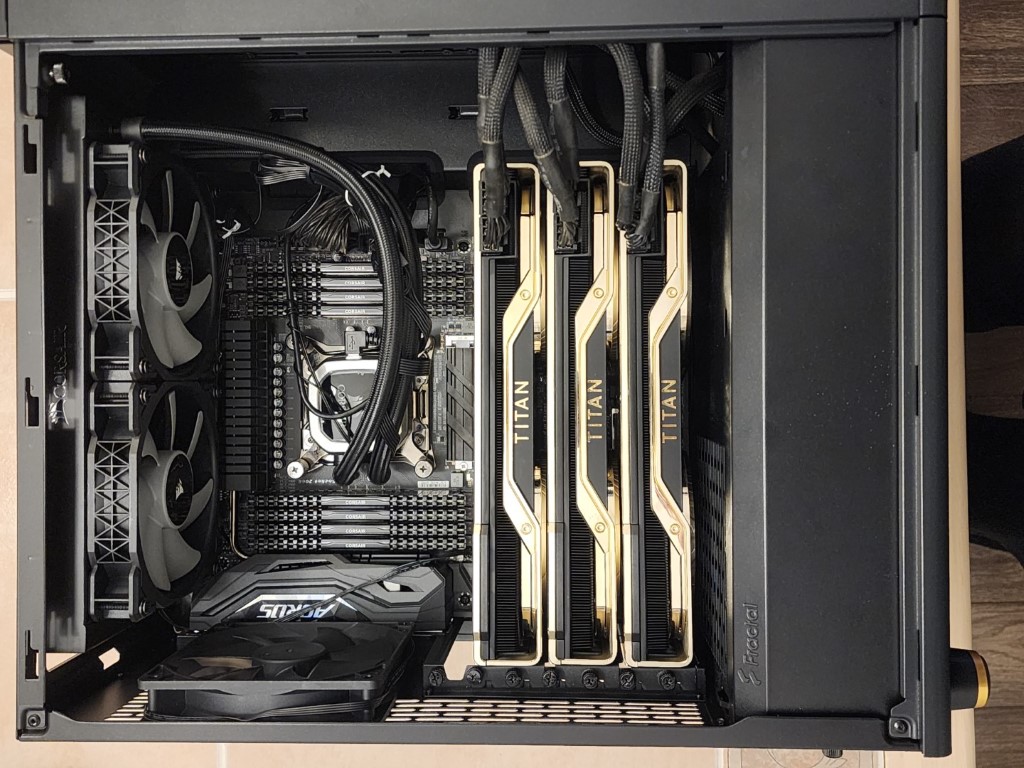 Socket 2066 build with TITAN-branded RAM, an Aorus graphics card, and a Corsair liquid cooling radiator